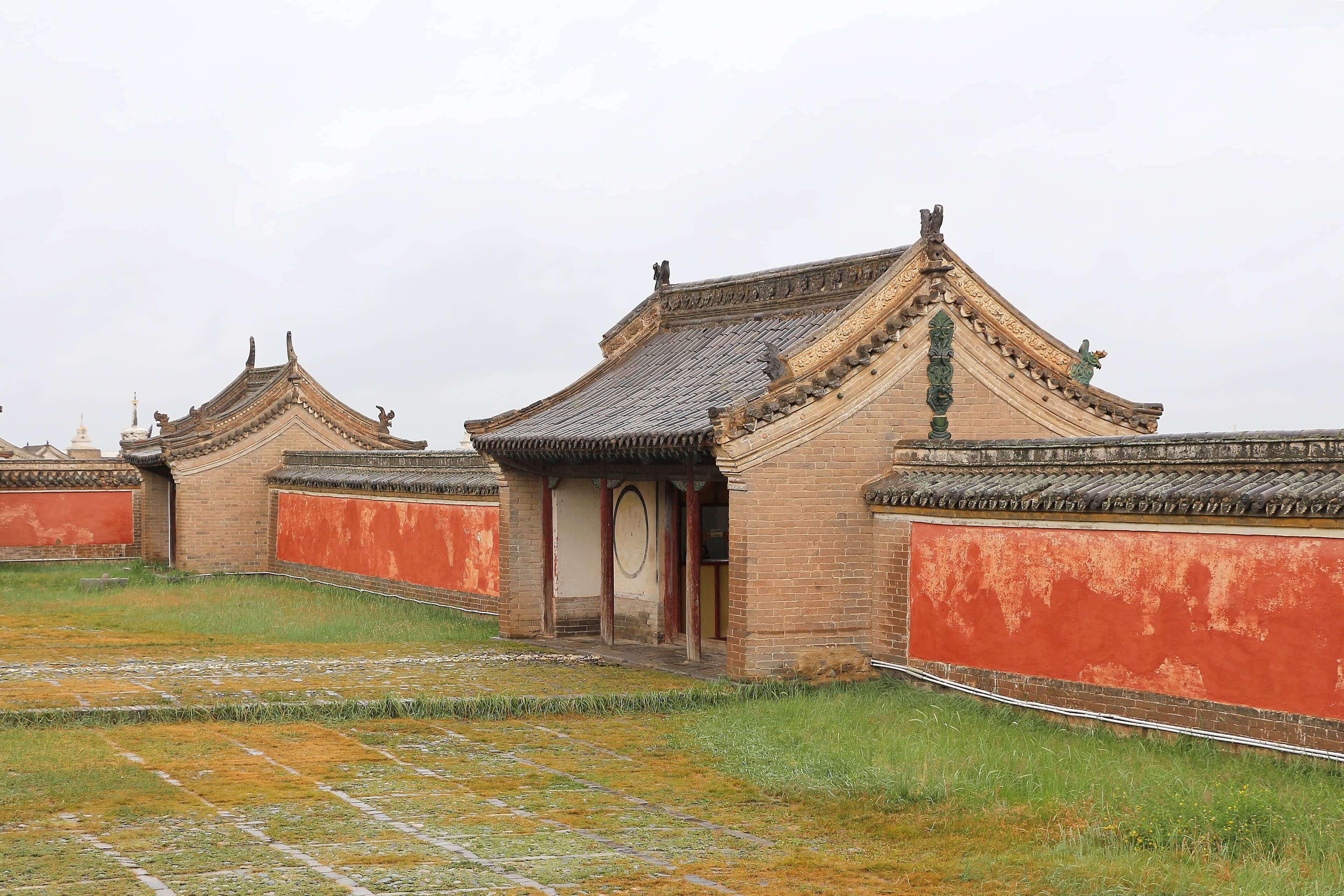 Red-walled temple buildings with tiled roofs inside Erdene Zuu Monastery, Mongolia