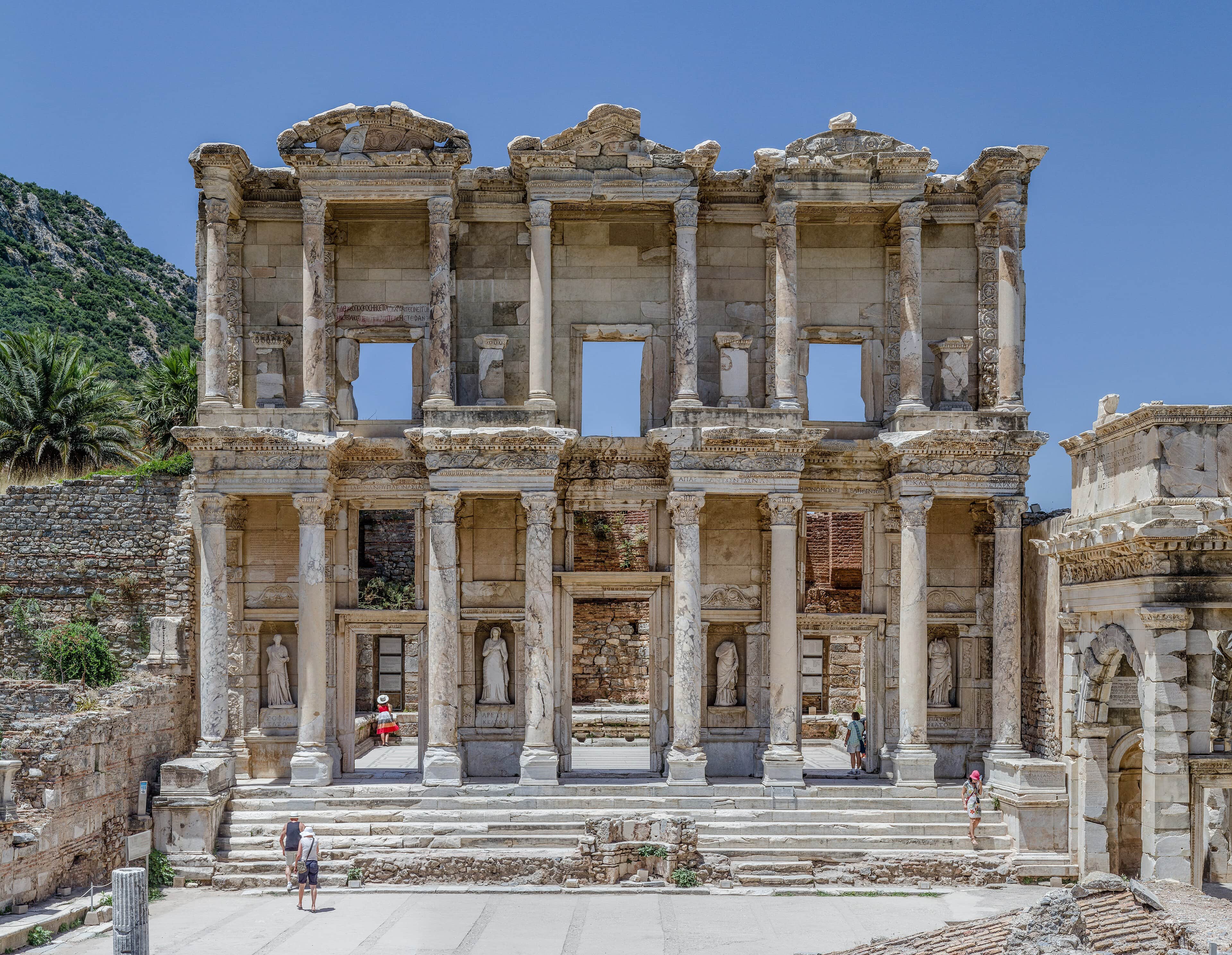 The sunlit façade of the Library of Celsus at Ephesus near Izmir under a clear blue sky