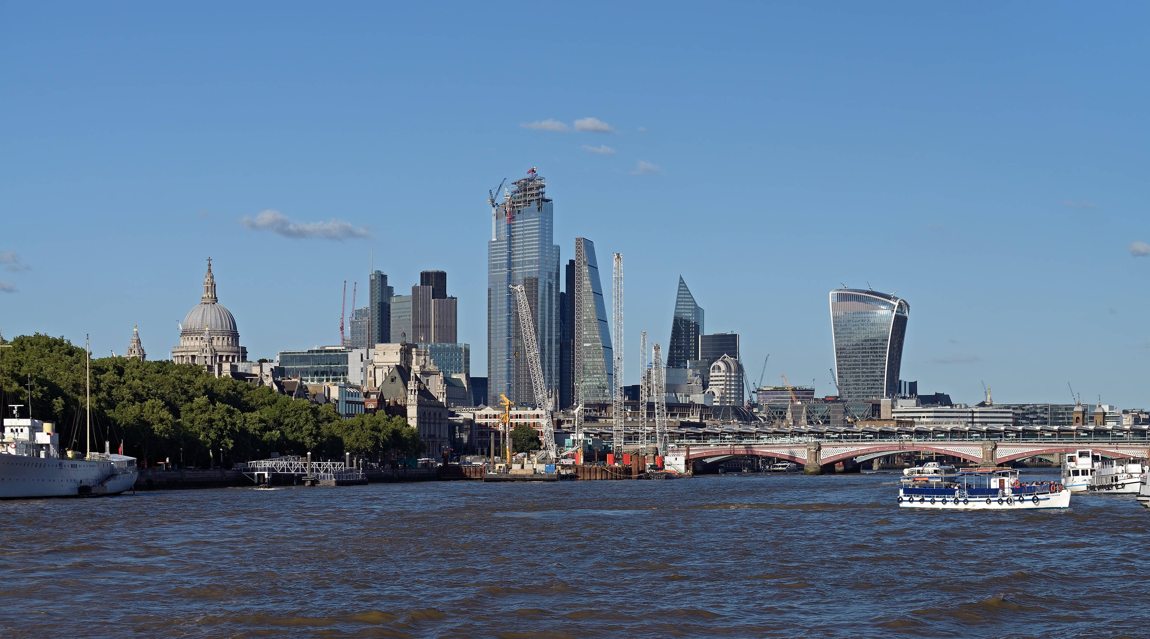 St Paul's Cathedral and the City of London skyline rising beyond Blackfriars Bridge, seen across the River Thames