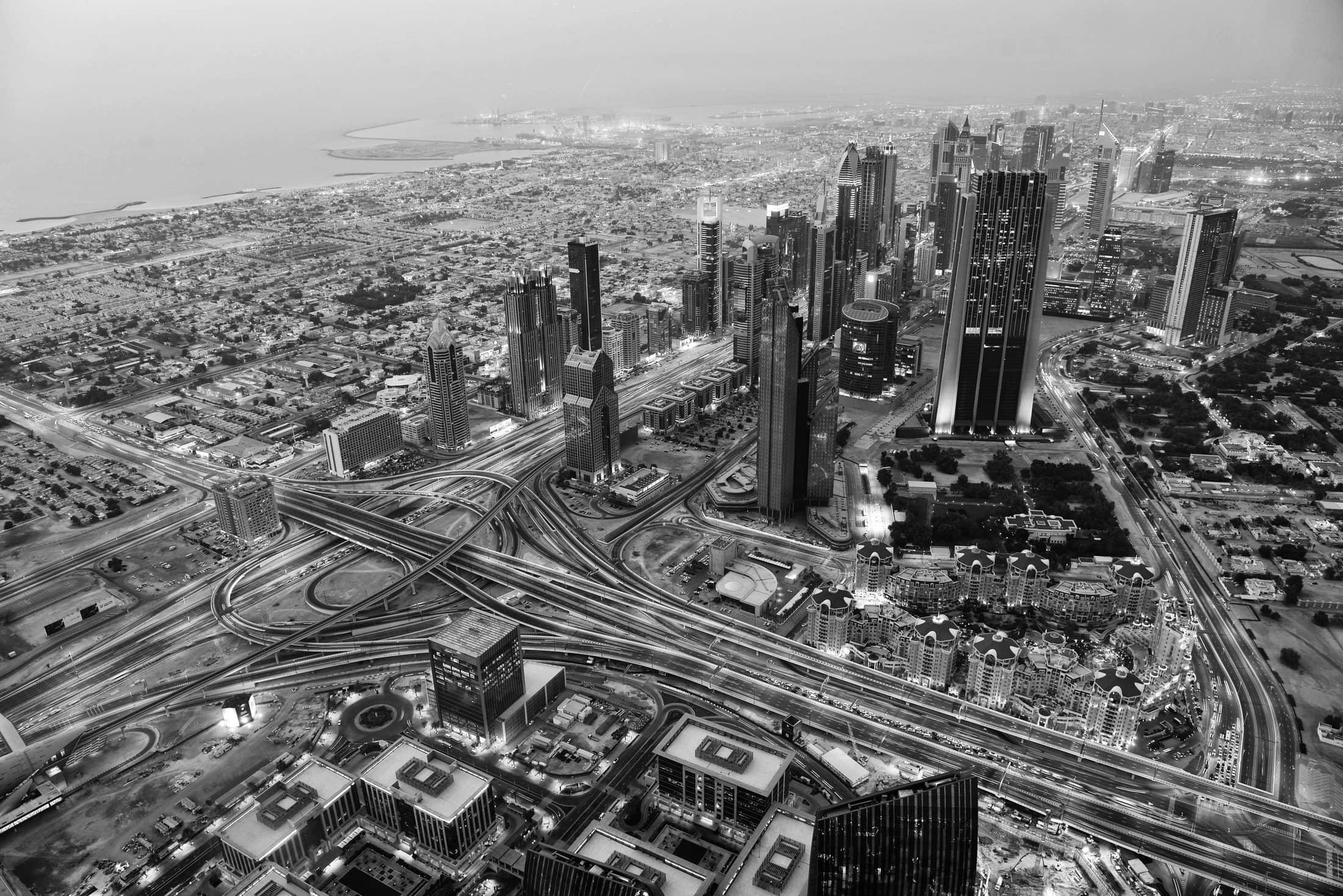 dubai city skyline main road and new skyscrapers at sunset
